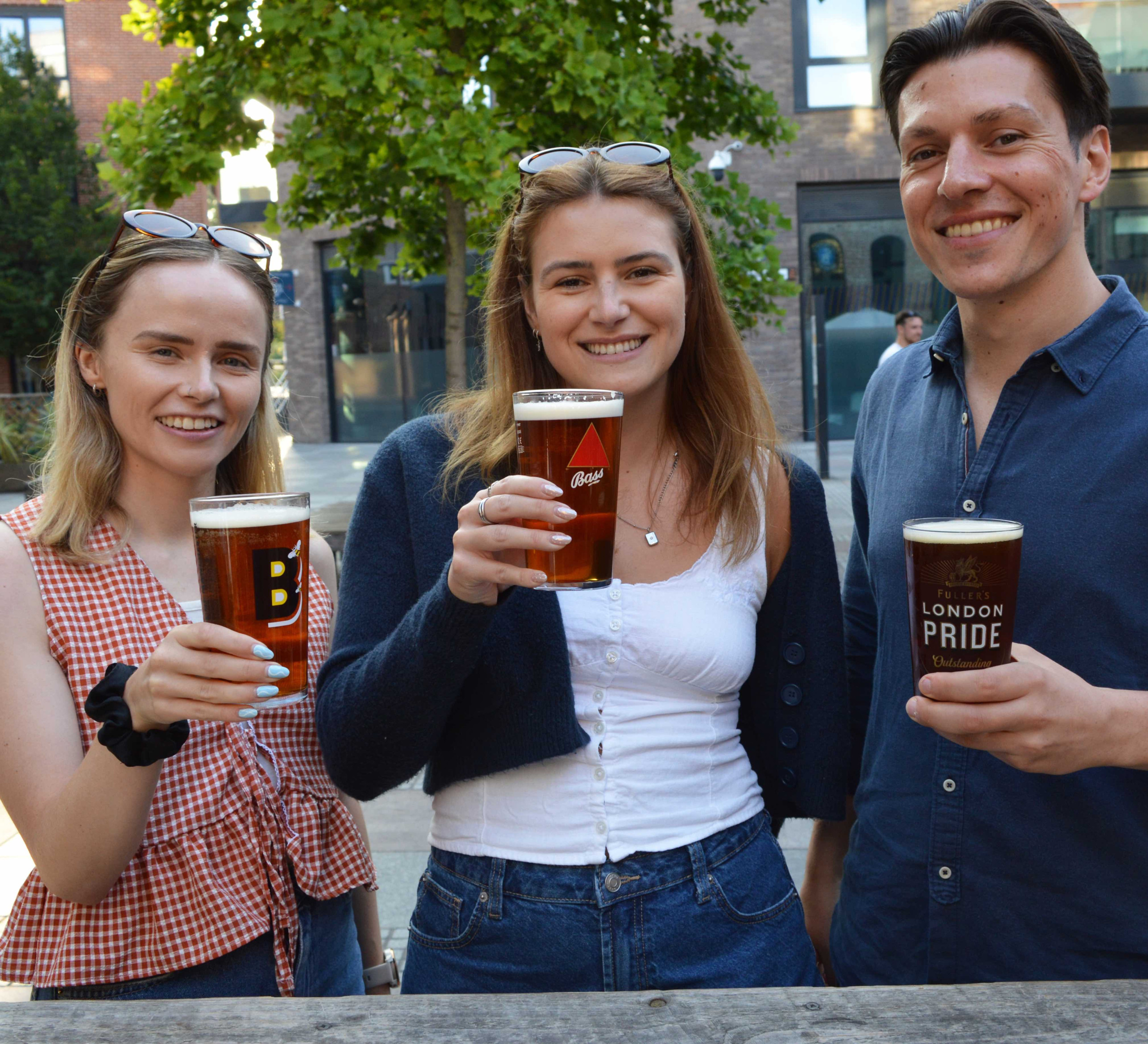 Young people with pints of cask ake
